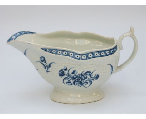 A first period Worcester pedestal sauce boat with marks to base (length 17cm)