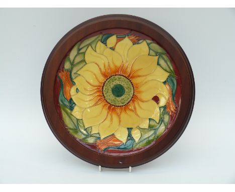 Moorcroft charger in Inca Sunflower pattern by Rachel Bishop, in wooden frame (26cm diameter)
