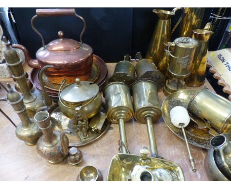 A large collection of brass and copper ware to include Welsh miner's lamp, kettle, meat jacks, elephant bell etc.