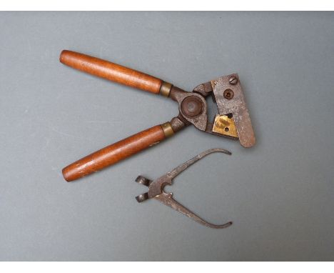 Two pairs .36 bullet moulding tools, one with wooden handles