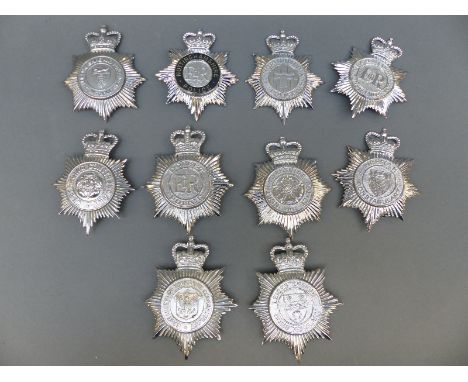 Ten police helmet badges including an enamel Nottinghamshire Constabulary example, North Yorkshire, Norfolk, Devon and Cornwa