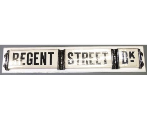 A vintage ceramic and cast iron Regent Street Bk road sign, removed by the vendor from a back to back terrace in Bolton, Lanc