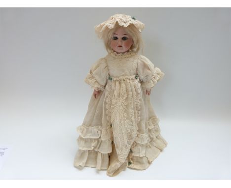 Armand Marseille bisque headed doll with open mouth, weighted blue eyes, soft body and articulated composite limbs marked to 