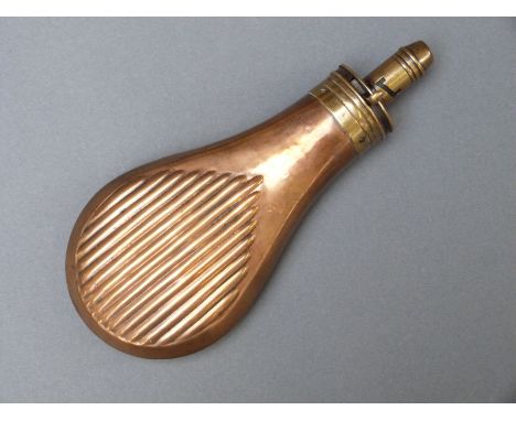 Sykes copper and brass powder flask with embossed reeded decoration, 19.5cm long. 