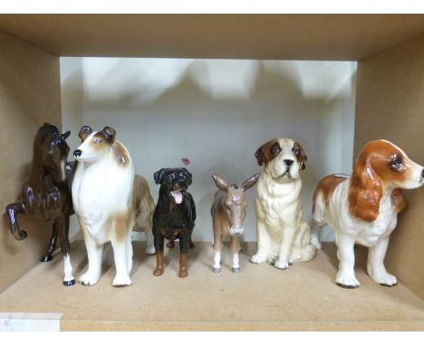 A collection of Beswick animals including donkey, horses, fox together with further ceramic examples