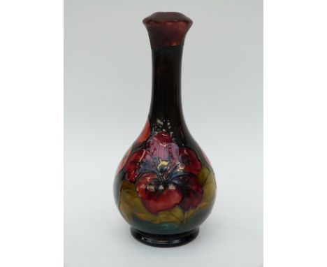 Moorcroft lamp in Hibiscus pattern by Walter Moorcroft with flambe glaze (22cm tall)