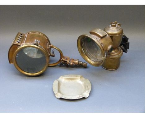An unusual brass spot lamp possibly ex motorcycle or vintage car with plaque to top 20th Century Mfg Co. New York, a Lucas ca