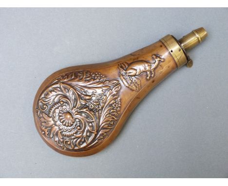 Copper and brass powder flask made for the Australian market with embossed decoration of a kangaroo, birds and flowers to bot