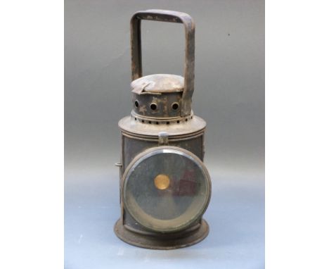 A tri colour railway hand lamp