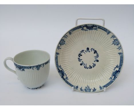 A first period Worcester tea cup and saucer with open crescent mark to base