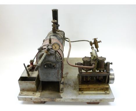 A freelance model steam engine with twin oscillating cylinders, boiler, regulator, sight glass, pressure gauge and hand opera