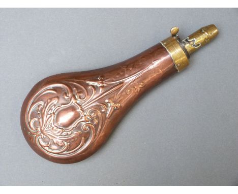 Sykes copper and brass powder flask with embossed flower and leaf decoration, 21cm long. 