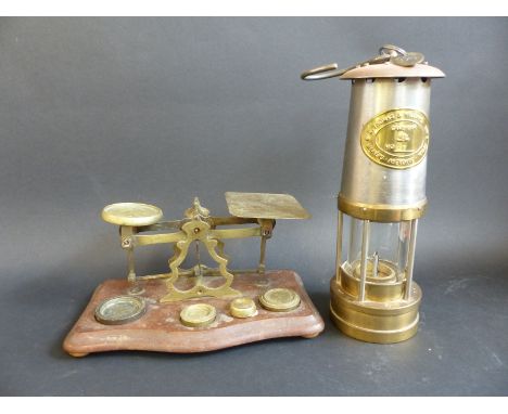 A miner's lamp by E Thomas and Willdens Ltd, Aberdere, Wales, used in the Britannia Colliery, complete with pay cheque and a 