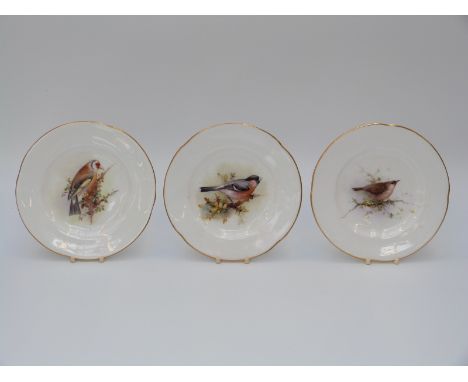 Three Royal Worcester plates hand decorated with birds (12.5cm diameter)