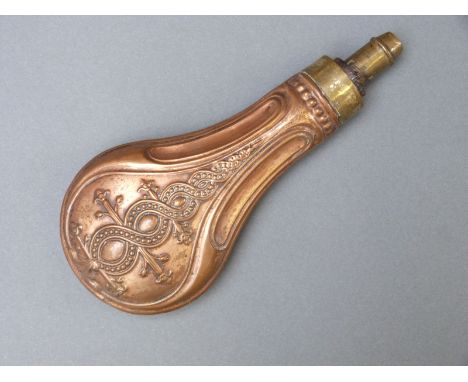 Copper and brass powder flask with embossed spiralling decoration, 20cm long 