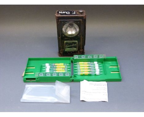 A Guardian traffic lamp and a small case of breath testing equipment.