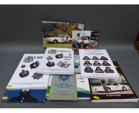 A quantity of books relating to police helmets and badges including Badges of Office by M B Taylor and V L Wilkinson