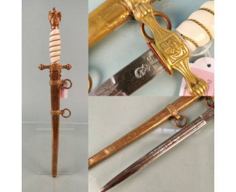 A second model Navy (Kriegsmarine) Officer's dress dagger by W.K.C. with its lightning scabbard. This example with very fine 