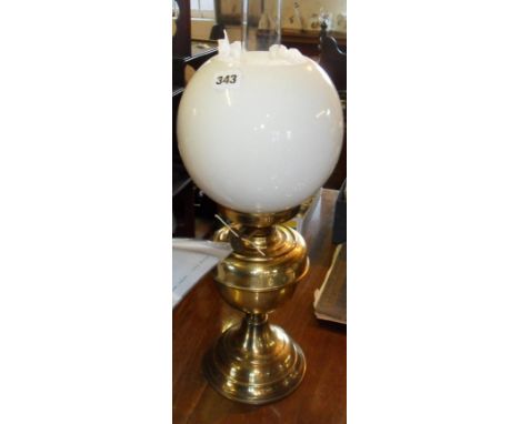 Brass oil lamp with white glass spherical shade