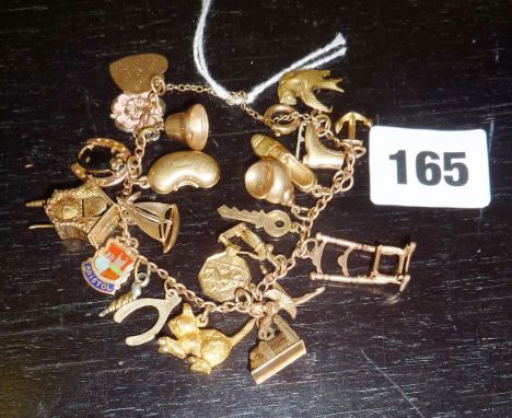 9ct gold bracelet with assorted charms including a mechanical cuckoo clock (approx 33gms)