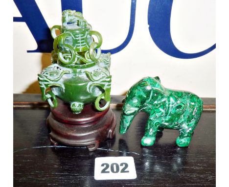 Small Chinese carved spinach jade lidded pot on stand, together with a malachite elephant