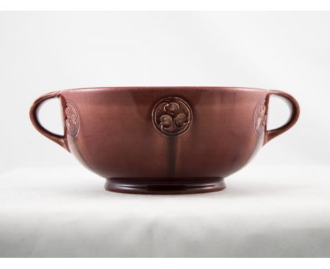 William Moorcroft Flamminian Ware Ruby Lustre Twin Handled Footed Bowl, with Foliate Roundels. c.1906-1913. 3.5 Inches High, 