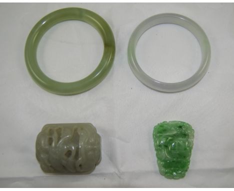 Two Various Jade Bangles plus a belt ornament and pendant, both of hand carved jade(4)