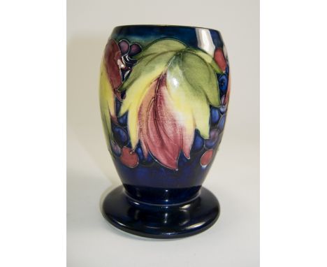 William Moorcroft Signed Vase ' Leaves and Berries ' Design on Blue Ground. c.1920's. 6 Inches High. Restoration and Over pai