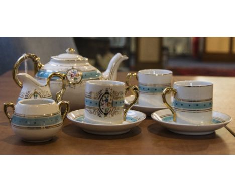 Child's Teaset comprising teapot, sugar bowl, milk jug and three cups and saucers. In blue and gilt decoration.