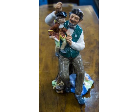 Royal Doulton Figure ' The Puppet Maker ' HN2253. Designer M. Nicoll. Issued 1962 - 1973. 8 Inches In Height. Mint Condition.