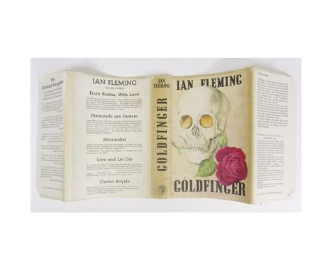 Fleming, IanGoldfinger. London: J. Cape, 1959. First edition, 8vo, black cloth with gold coins in eye sockets, owner's inscri