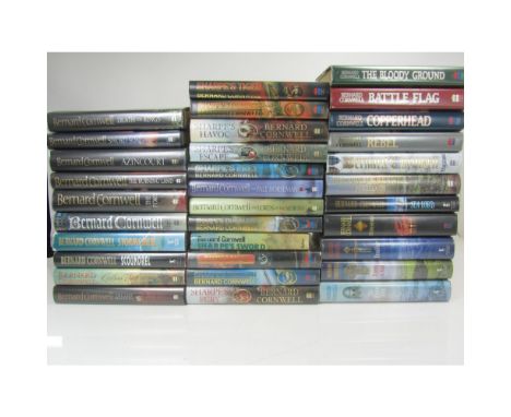 Cornwell, Bernard, a collection comprising 31 signed first editions, & other volumes, and Sharpe memorabilia, including:Sharp