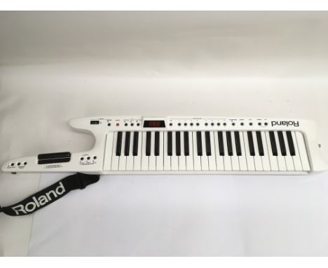 A Roland AX7 'keytar' midi keyboard controller. Comes supplied with original retail box and manual.