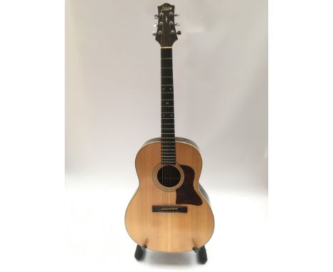 A Hohner acoustic guitar. Comes supplied with a soft gig bag.