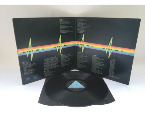 A first UK pressing of 'Dark Side Of The Moon' by Pink Floyd in NM condition with solid blue triangle on labels, A-2/B-2 matr