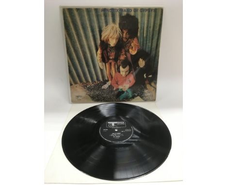 A first UK pressing of 'Band Of Gypsys' by Jimi Hendrix with rare puppet sleeve 2406 002. Record is NM, sleeve VG with wear t