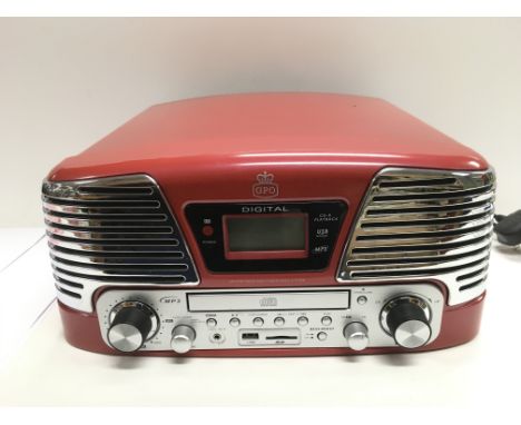 A modern GPO 'Memohis' music centre comprising turntable, CD, MP3 player. Comes supplied with manual.