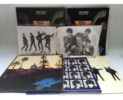 A collection of LPs and 7inch singles by The Beatles, The Who, Jimi Hendrix and others plus some Beatles publicity photos, au