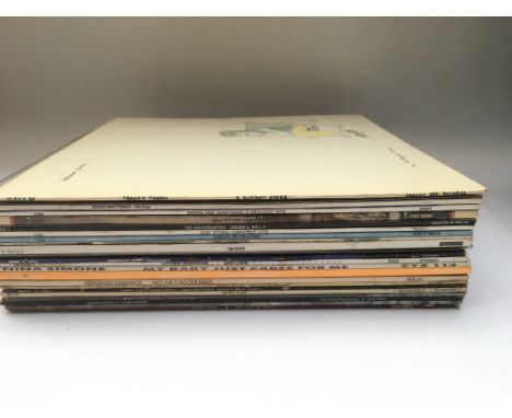 A record case of LPs by various artists including David Bowie, Bob Dylan, Meat Loaf and others.