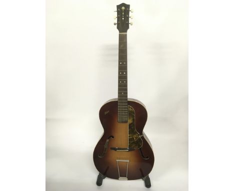 A vintage Hofner Congress guitar and soft gig bag.