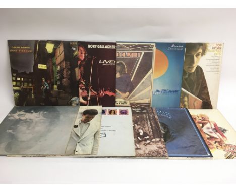 Eleven rock LPs by various artists including David Bowie, John Lennon, Bob Dylan and others.