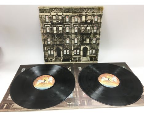 A first UK pressing of Led Zeppelin 'Physical Graffiti' SSK89400. Vinyl is NM. Sleeve spine is ripped.