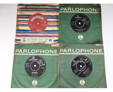 Four Beatles 7inch singles including a red label 'Love Me Do' 45-R 4949.