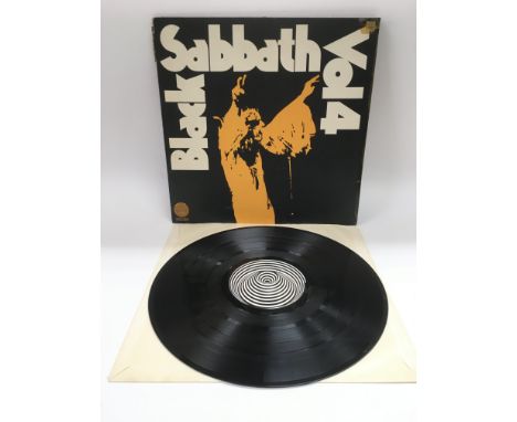A first UK pressing of 'Vol 4' by Black Sabbath 6360 071. Record is NM, sleeve spine is ripped near the top and has sellotape