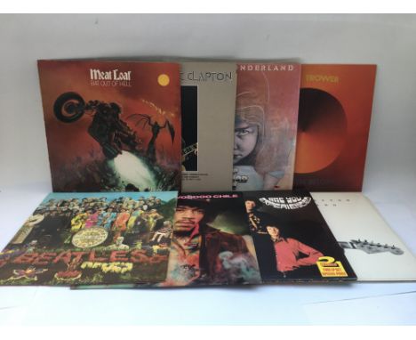 A collection in two bags of 18 rock and heavy rock LPs by various artists including Deep Purple, Jimi Hendrix, The Beatles, A