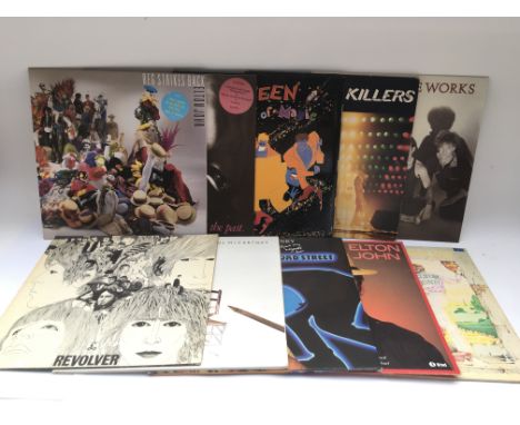 A collection of LPs, 7inch singles and EPs by The Beatles, The Rolling Stones, Queen and Elton John.