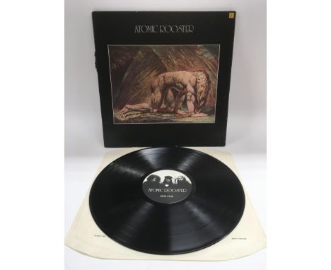 A first UK pressing of 'Death Walks Behind You' by Atomic Rooster CAS1026. Vinyl is NM, sleeve spine has a rip and worn outer