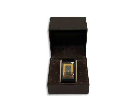 A lady's Gucci watch with wide leather strap, with box and papers.