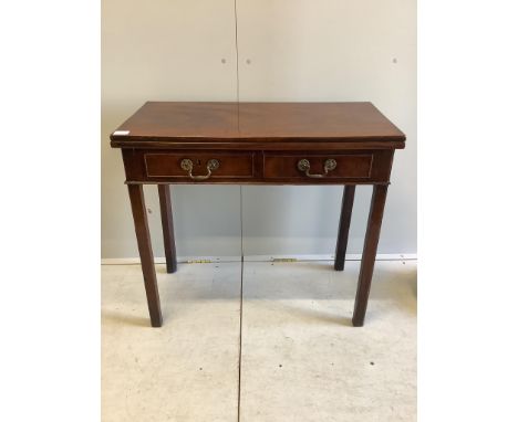 A George III rectangular mahogany folding card table, width 84cm, depth 41cm, height 76cm. Condition - fair