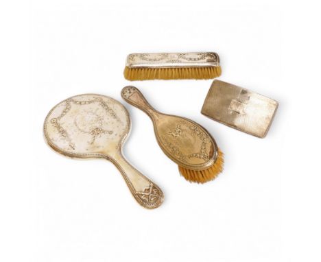 A George V three piece silver mounted three piece mirror and brush set by William Hutton &amp; Sons Ltd and one other silver 